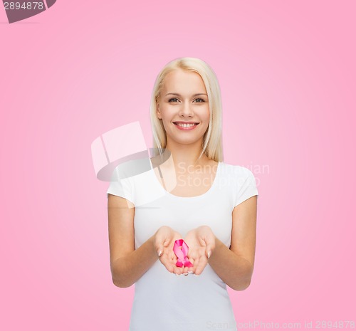 Image of woman holding pink cancer awareness ribbon