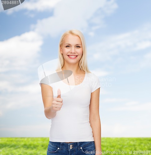 Image of woman showing thumbs up