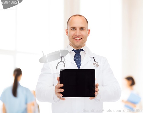 Image of smiling male doctor with stethoscope and tablet pc