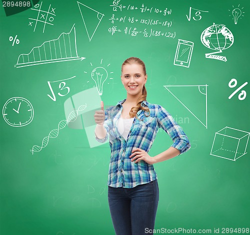 Image of smiling student girl showing thumbs up