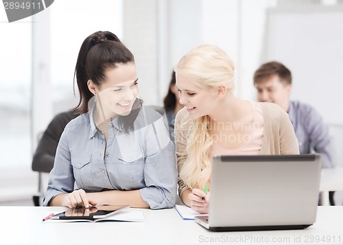 Image of students with laptop, tablet pc and notebooks