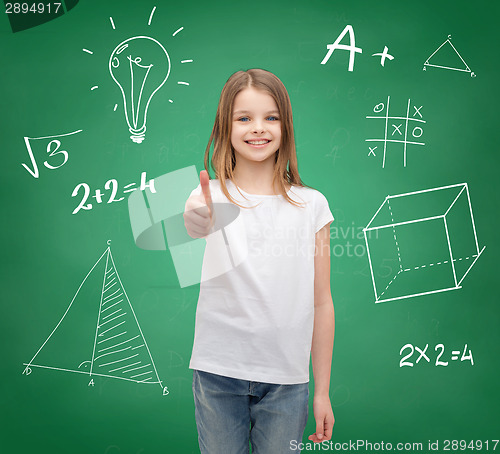 Image of smiling girl in white t-shirt showing thumbs up