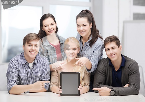 Image of smiling students with blank tablet pc screen