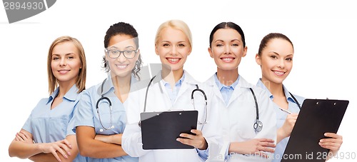 Image of smiling female doctors and nurses with stethoscope