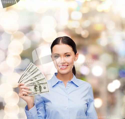 Image of businesswoman with dollar cash money