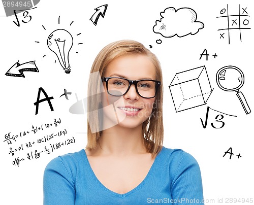 Image of smiling woman in black glasses