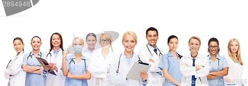 Image of smiling doctors and nurses with tablet pc