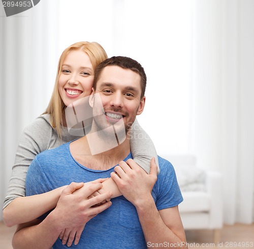 Image of smiling couple hugging