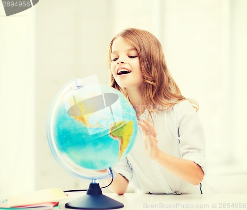 Image of student girl with globe at school