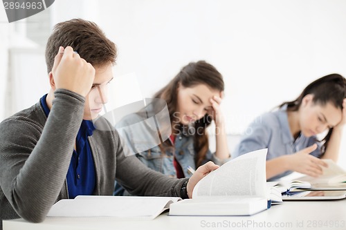 Image of students with notebooks and tablet pc at school