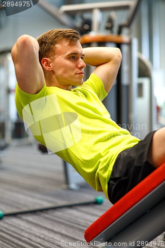 Image of man exercising in gym