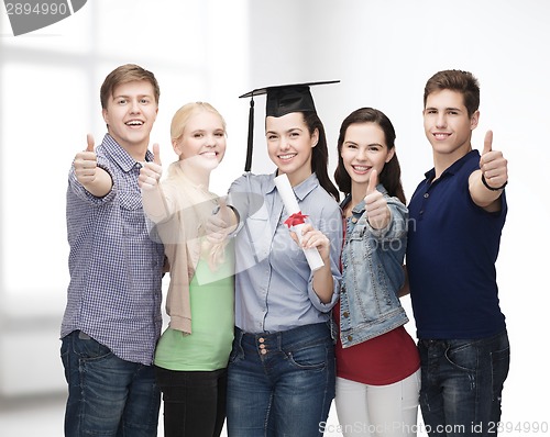 Image of group of students with diploma showing thumbs up