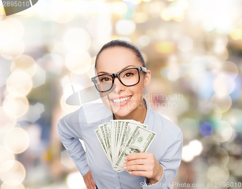 Image of smiling businesswoman with dollar cash money