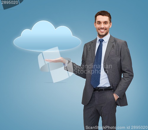 Image of smiling businessman holding cloud icon