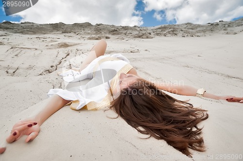 Image of Attractive girl in greek tunic