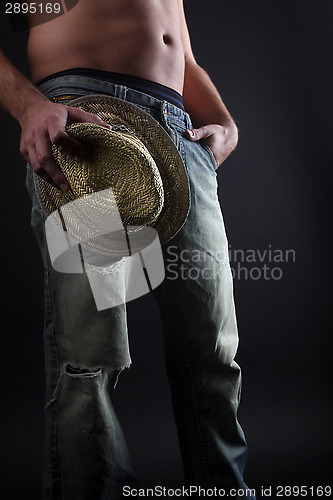 Image of Attractive man with a straw hat