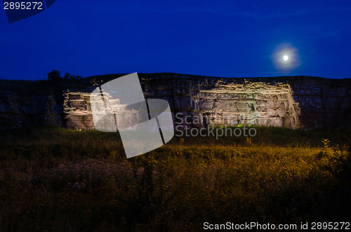 Image of Moonlight over illuminated cliffs