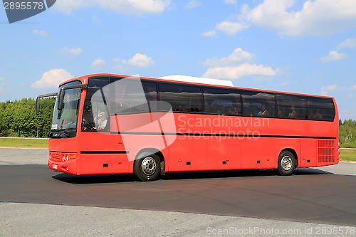 Image of Moving Red Coach Bus 