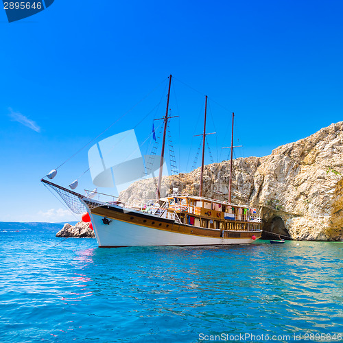 Image of Vintage sailing boat in bay.