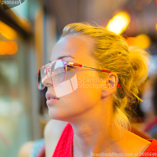 Image of Woman looking out tram's window.