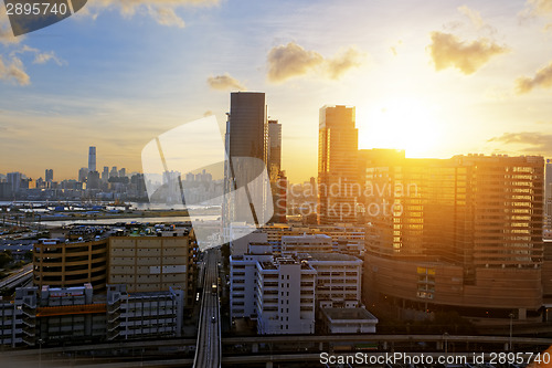 Image of Urban downtown city at sunset,