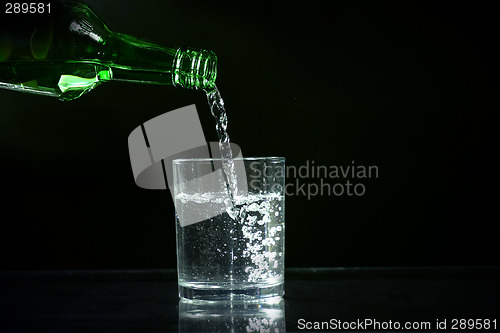 Image of wine bottle and glass of ice