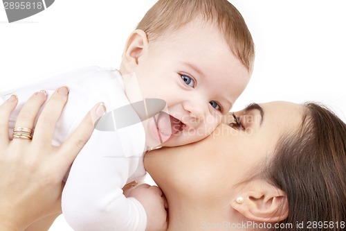 Image of happy mother kissing baby