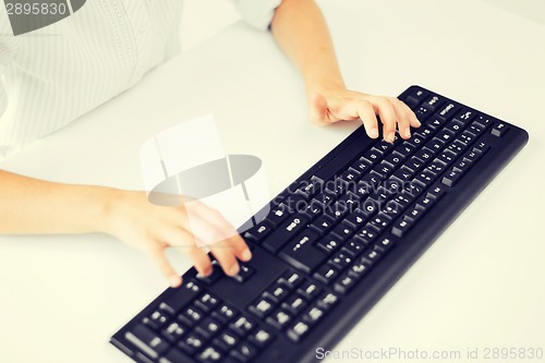 Image of student girls hands typing on keyboard