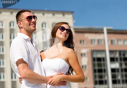 Image of smiling couple in city