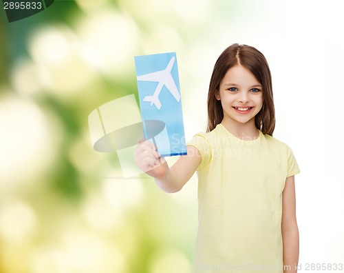 Image of smiling little girl with airplane ticket