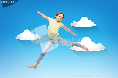 Image of smiling little girl jumping