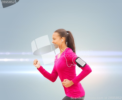 Image of smiling young woman running