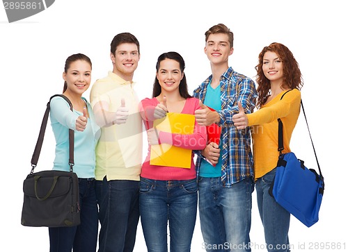 Image of group of smiling teenagers showing thumbs up