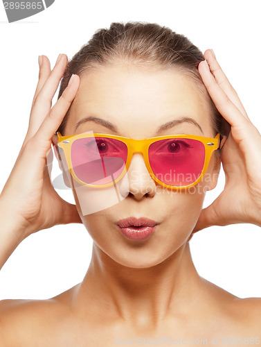 Image of surprised teenage girl in pink sunglasses