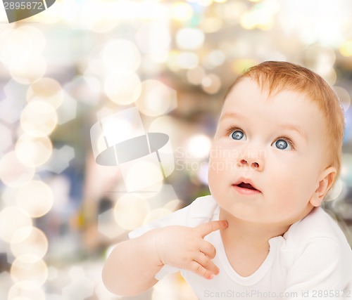 Image of curious baby looking up