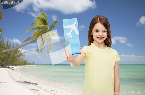 Image of smiling little girl with airplane ticket