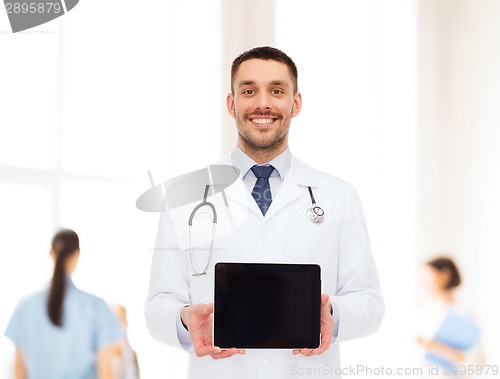 Image of smiling male doctor with tablet pc