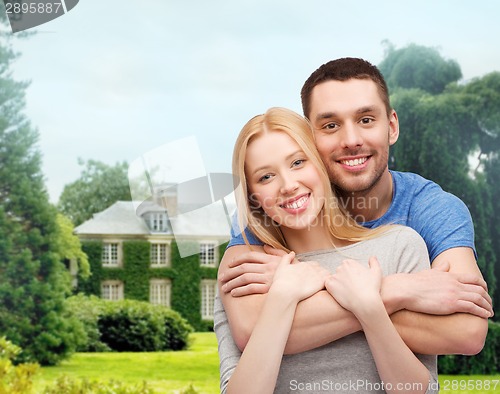 Image of smiling couple hugging