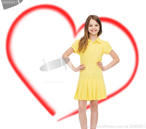 Image of smiling little girl in yellow dress