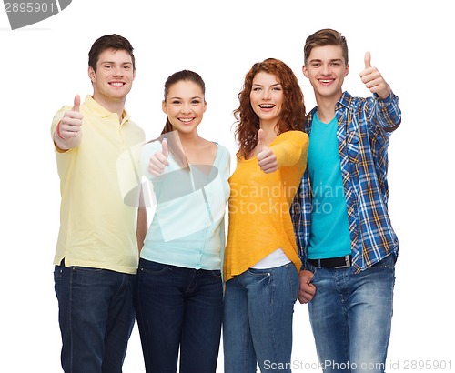 Image of group of smiling teenagers showing thumbs up