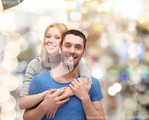 Image of smiling couple hugging