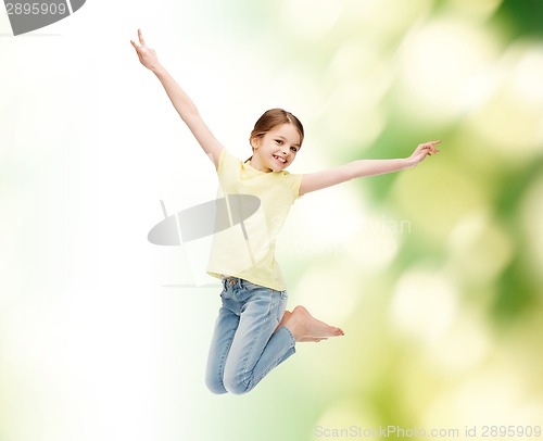 Image of smiling little girl jumping