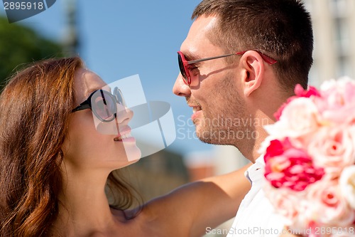 Image of smiling couple in city