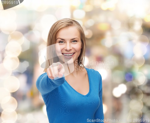Image of smiling student pointing finger at you