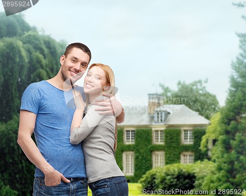 Image of smiling couple hugging