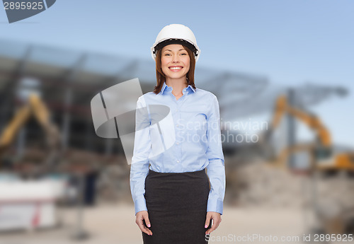 Image of businesswoman in white helmet