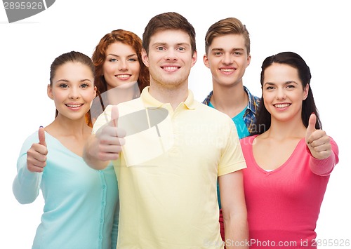 Image of group of smiling teenagers showing thumbs up