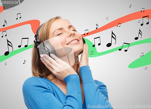 Image of smiling young woman with headphones