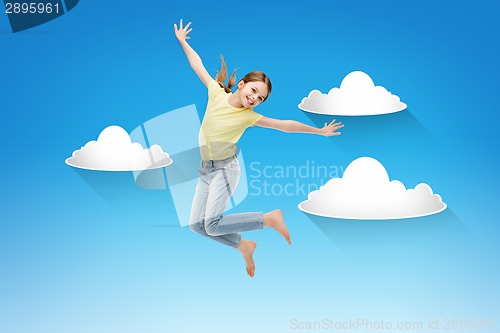 Image of smiling little girl jumping