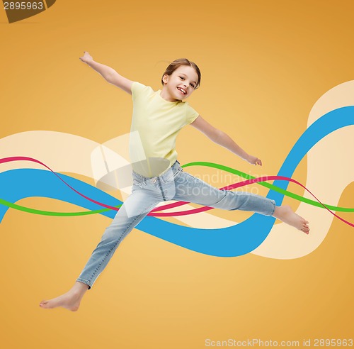 Image of smiling little girl jumping